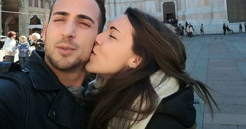 Couple kissing in city