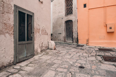 Alley amidst buildings in city