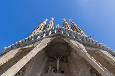 Low angle view of building against blue sky