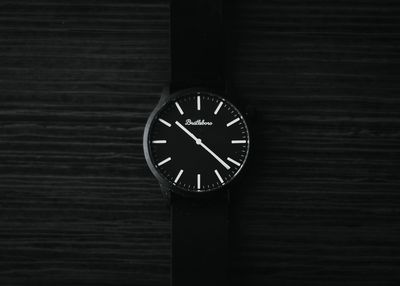 Close-up of clock on wood