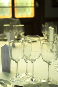 Close-up of wine glasses on table