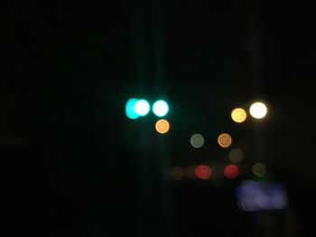 Defocused image of illuminated lights at night