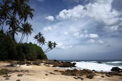 View of calm beach against the sky