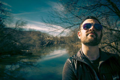 Man wearing sunglasses in lake