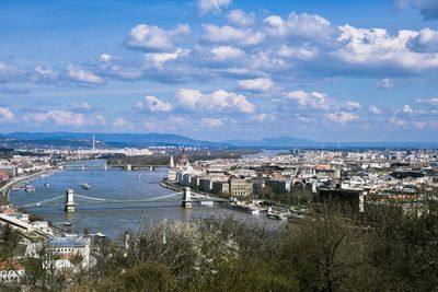 Cityscape against cloudy sky
