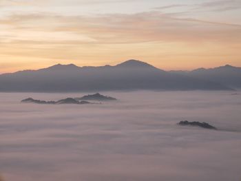 Scenic view of mountains against sky during sunset