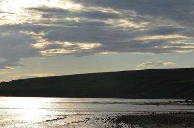 View of calm lake against mountain range