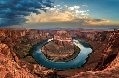 Aerial view of rock formations against sky during sunset