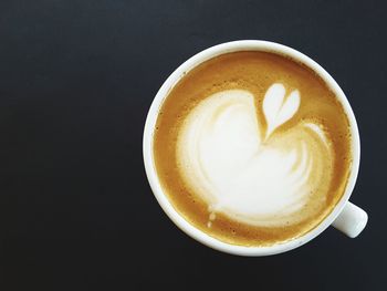 High angle view of cappuccino on table