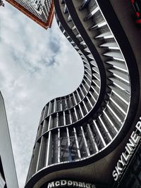 Low angle view of spiral staircase in building against sky