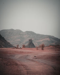 Scenic view of desert against clear sky