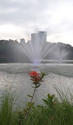 Scenic view of lake against cloudy sky