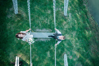 High angle view of swing hanging on playground