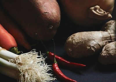 Close-up of red chili peppers on table