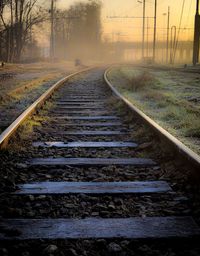 View of railroad tracks on foggy day