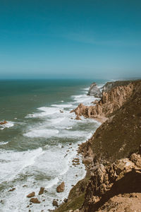 Scenic view of sea against clear blue sky