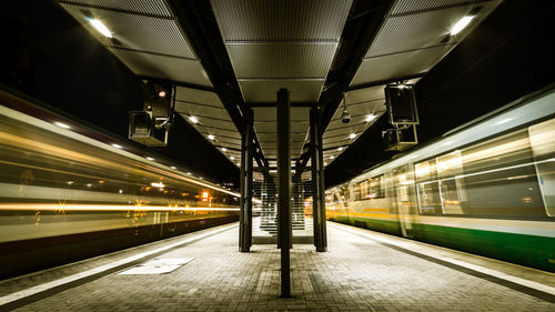 Long exposure of trains on railroad station at night