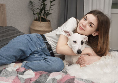 Young woman with dog at home