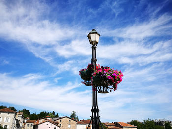 Low angle view of street light against sky