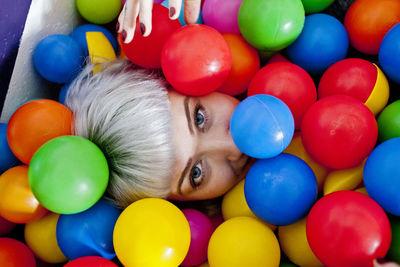 Young woman in a ball pit