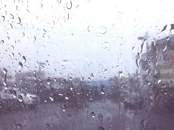 Full frame shot of raindrops on glass window