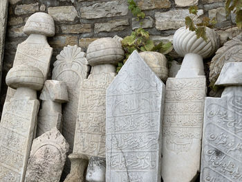 Close-up of ancient tombstone in fort cesme turkey