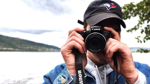 Portrait of man photographing