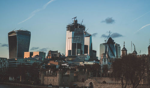 Buildings in city against sky