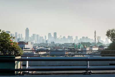 View of buildings in city against sky