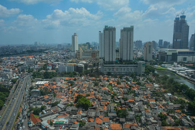High angle view of buildings in city against sky