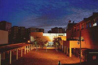 Illuminated buildings against sky