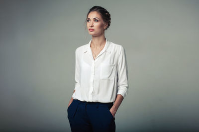 Portrait of a beautiful young woman over white background
