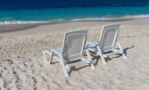 Deck chairs on beach