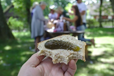 Cropped hand holding ice cream cone