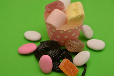 Close-up of multi colored candies on table