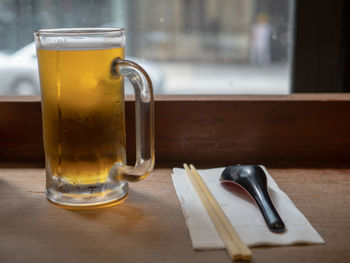 Close-up of beer in glass on table