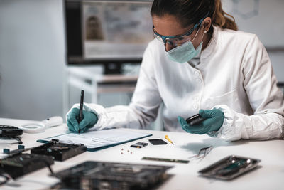 Female scientist working at crime laboratory