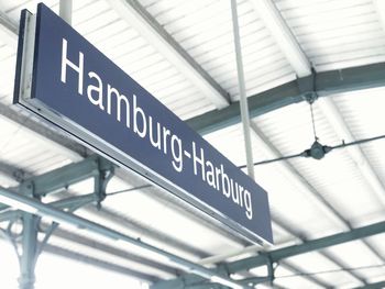 Low angle view of information sign at airport