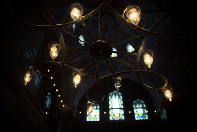 Low angle view of illuminated chandelier