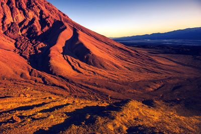 Scenic view of mountains against sky during sunset