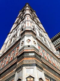 Low angle view of building against blue sky