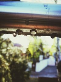 Close-up of metal against sky