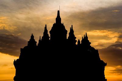 Silhouette temple against sky during sunset