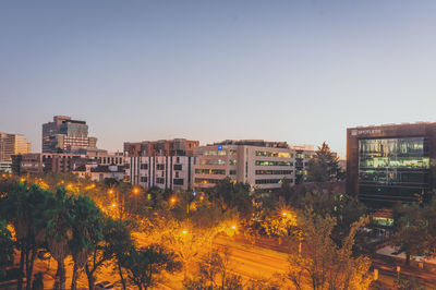 City buildings against clear sky