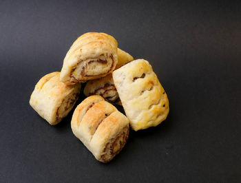 High angle view of bread on table against black background