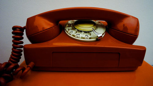 Close-up of telephone on table