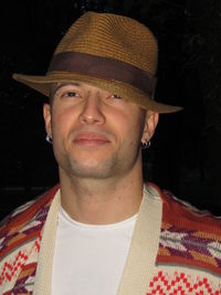 Close-up portrait of smiling mid adult man wearing hat