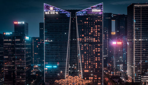 Illuminated buildings in city at night