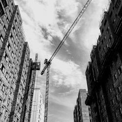 Low angle view of buildings in city against sky