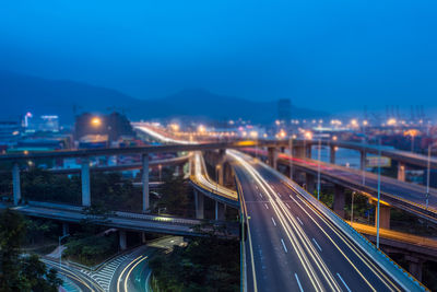 High angle view of light trails on highway at night